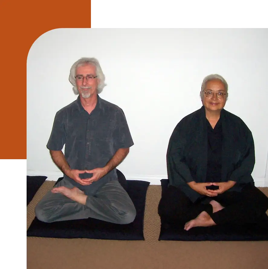 Two people sitting in meditation